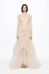 Long sleeved dress in vanilla with asymmetrical skirt
