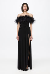 Black dress with open shoulders and feathers