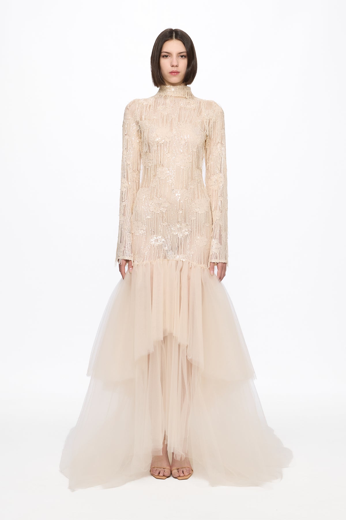 Long sleeved dress in vanilla with asymmetrical skirt