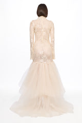 Long sleeved dress in vanilla with asymmetrical skirt