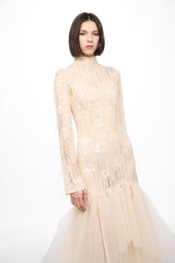 Long sleeved dress in vanilla with asymmetrical skirt
