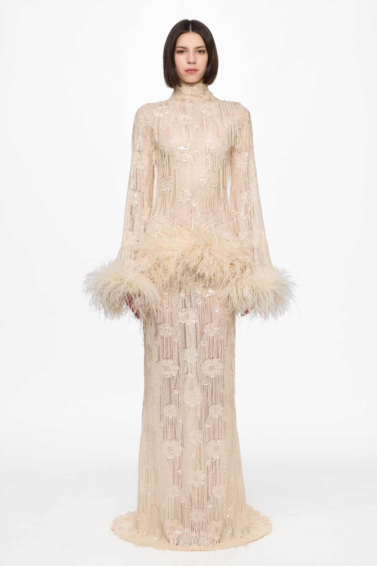 Long sleeved dress in vanilla with feather applications