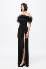 Black dress with open shoulders and feathers
