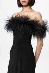 Black dress with open shoulders and feathers